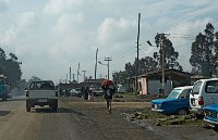 taxis cars and huts by the roadside in Addis Ababa Ethiopia