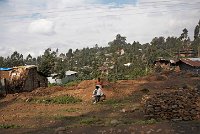 Young men sitting by the roadside in Addis Ababa Ethiopia