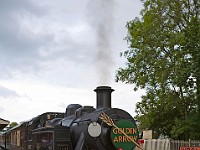 Steam engine with Pullman cars waiting at Sheffield Park station
