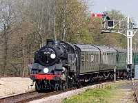 Steam tank engine 2-6-4 pulling passenger train Bluebell railway