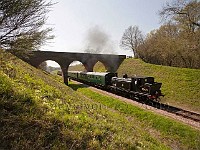 Steam tank engine pulling passenger train Bluebell railway